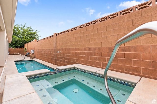 1095 S White Sands Dr, Washington, UT 84780 - view of pool with an in-ground hot tub and fence