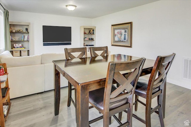 dining area featuring light wood-type flooring