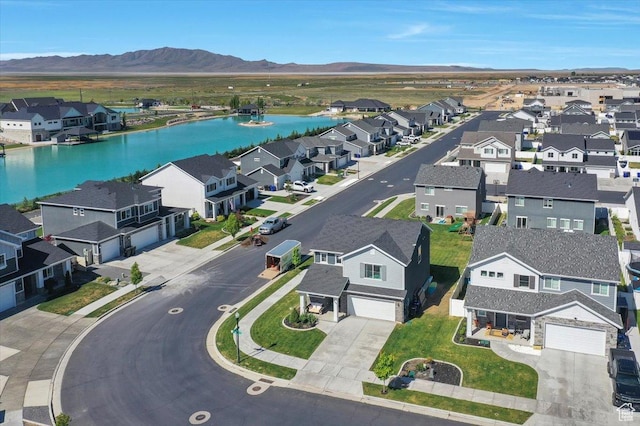 aerial perspective of suburban area with a water and mountain view
