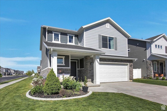 view of front facade with stone siding, concrete driveway, a garage, and a front yard