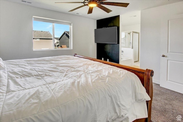 carpeted bedroom featuring ceiling fan and connected bathroom