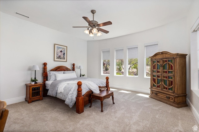 bedroom with carpet, baseboards, and ceiling fan