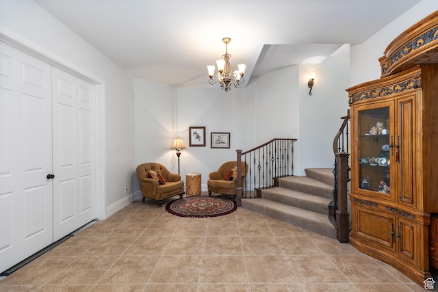 living area featuring a chandelier and stairway
