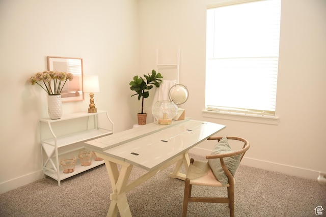 carpeted office with plenty of natural light and baseboards