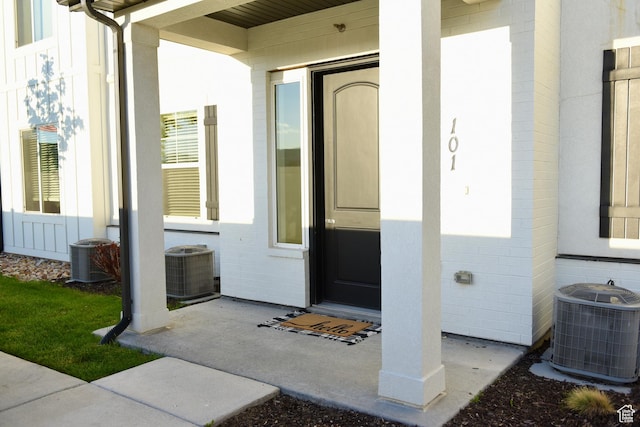 doorway to property featuring cooling unit
