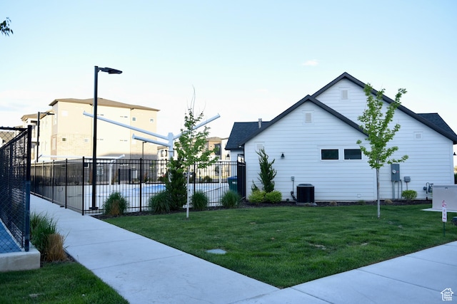 view of side of home with central AC unit