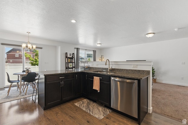 164 E Boxcar Ln S, Saratoga Springs, UT 84045 - kitchen with stainless steel dishwasher, a sink, a chandelier, a textured ceiling, and dark stone counters