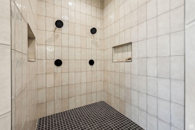 full bathroom with tiled shower
