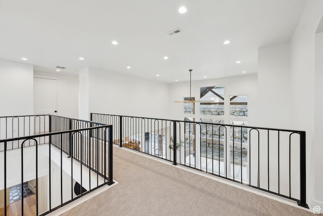 corridor with recessed lighting and carpet flooring