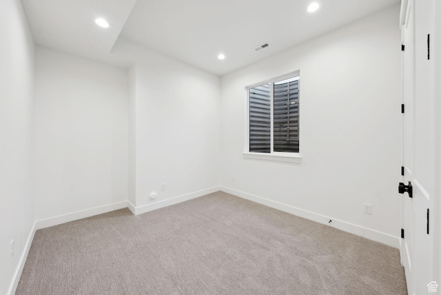 carpeted empty room with recessed lighting and baseboards