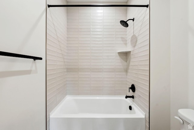 bathroom with toilet and bathtub / shower combination