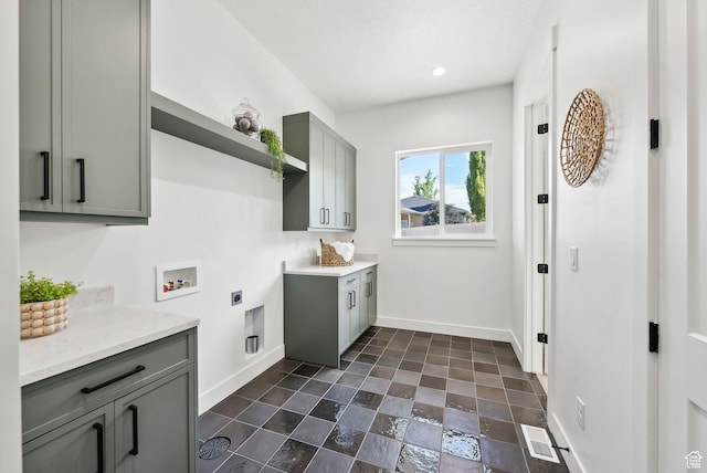 laundry area featuring cabinet space, hookup for an electric dryer, baseboards, washer hookup, and recessed lighting