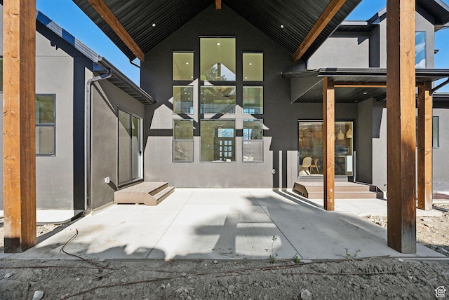 back of house with stucco siding