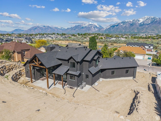aerial view of residential area featuring a mountainous background