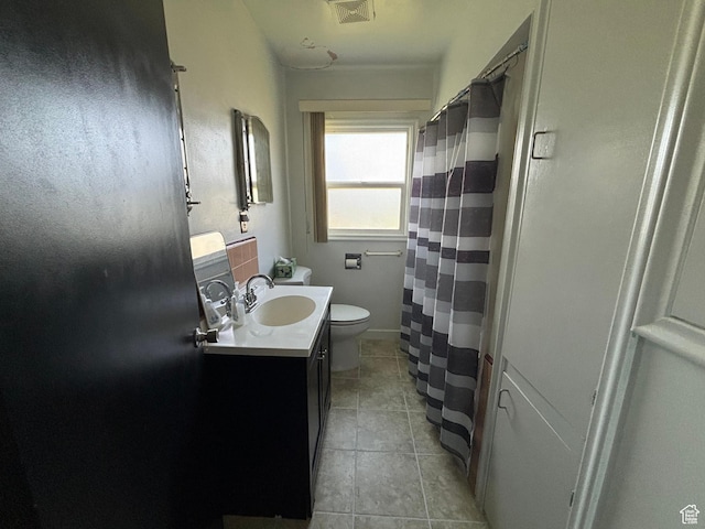 full bath with toilet, vanity, tile patterned floors, and a shower with shower curtain