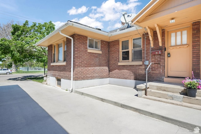 view of home's exterior featuring brick siding
