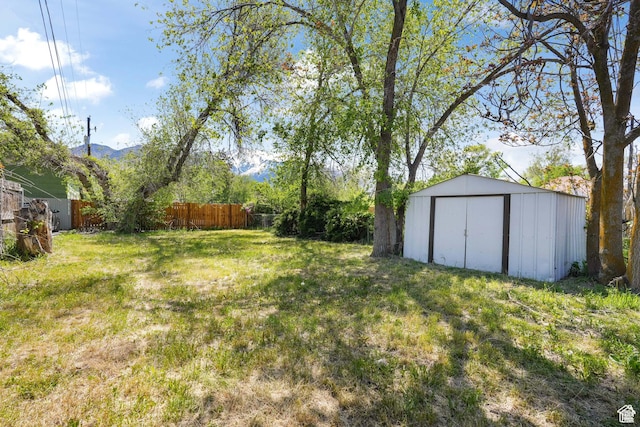 view of yard with a storage unit and an outdoor structure