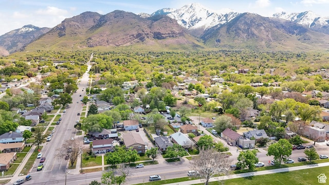 aerial overview of property's location featuring mountains and nearby suburban area