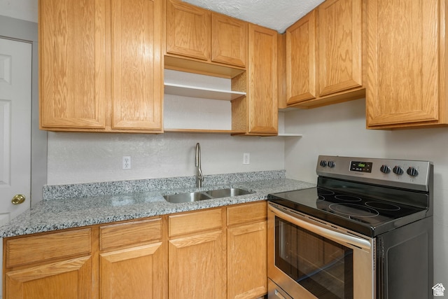 kitchen featuring stainless steel electric range, a sink, open shelves, light stone countertops, and a textured ceiling