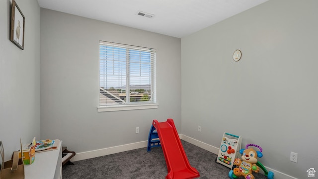 playroom featuring carpet flooring and baseboards