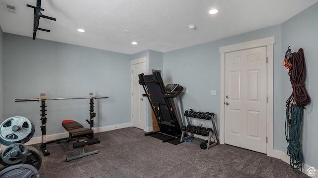 workout area featuring recessed lighting, baseboards, and carpet floors