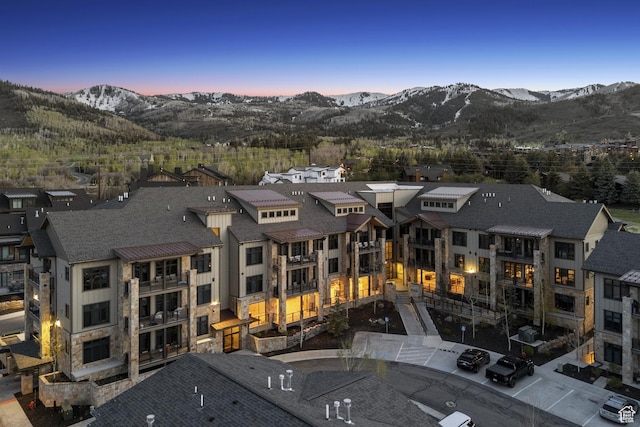 aerial view at dusk of a mountain view and a residential view
