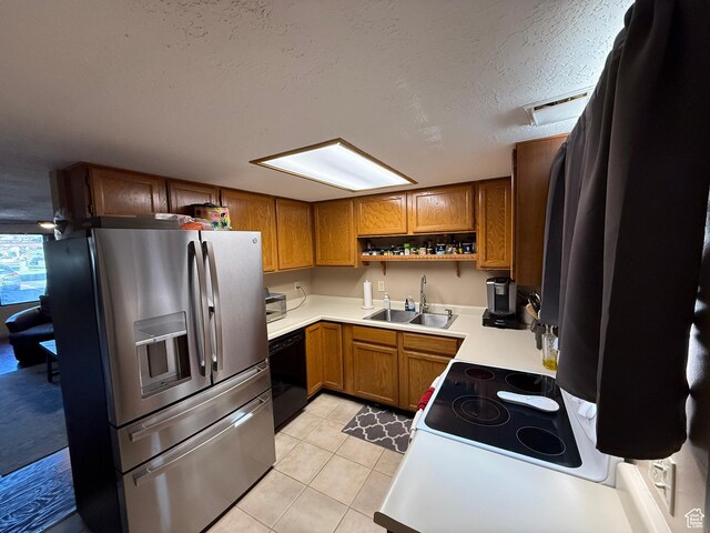 kitchen featuring stainless steel refrigerator with ice dispenser, a sink, black dishwasher, open shelves, and brown cabinets