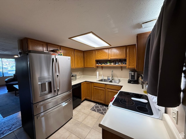 kitchen featuring stainless steel fridge with ice dispenser, a sink, black dishwasher, brown cabinetry, and a textured ceiling