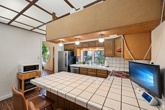 528 N Westcapitol St, Salt Lake City, UT 84103 - kitchen featuring stainless steel appliances, tile countertops, baseboards, and wallpapered walls