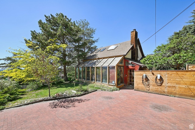 528 N Westcapitol St, Salt Lake City, UT 84103 - view of property exterior with a greenhouse, a chimney, fence, and an outdoor structure
