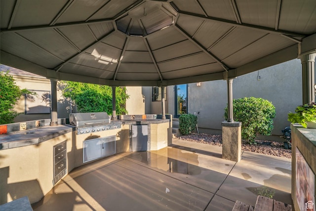 view of patio with a gazebo and area for grilling