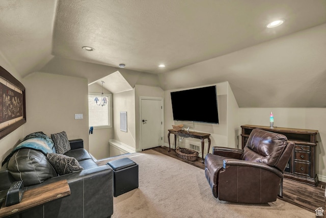 living area with vaulted ceiling, baseboards, recessed lighting, a textured ceiling, and wood finished floors