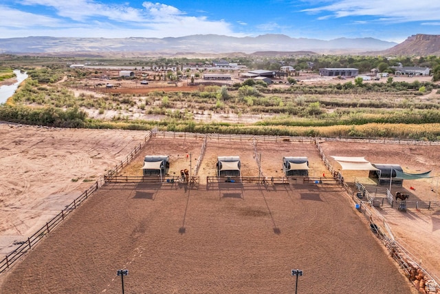aerial view of sparsely populated area featuring a mountain backdrop