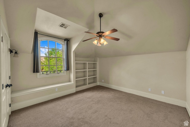 bonus room featuring lofted ceiling, carpet floors, ceiling fan, and baseboards