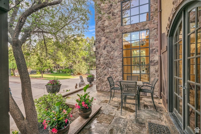 view of patio / terrace with french doors and outdoor dining space