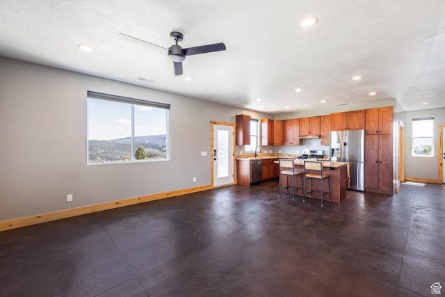 420 E Rockport Aspen Dr, Coalville, UT 84017 - kitchen featuring appliances with stainless steel finishes, baseboards, recessed lighting, and healthy amount of natural light