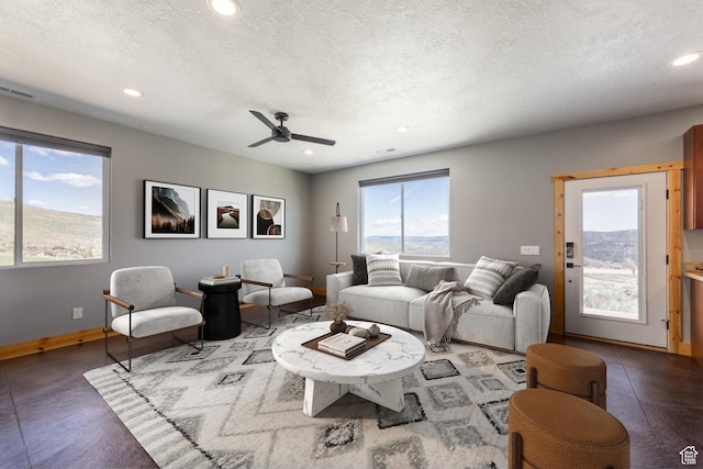 420 E Rockport Aspen Dr, Coalville, UT 84017 - living area with plenty of natural light, recessed lighting, baseboards, ceiling fan, and a textured ceiling