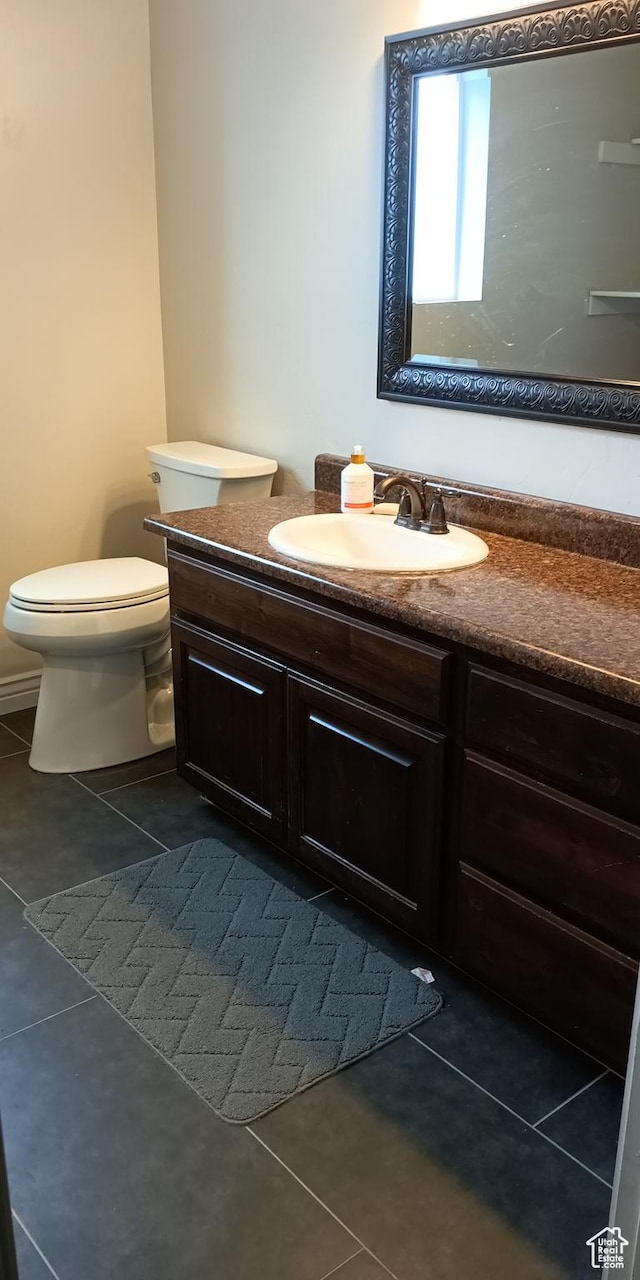 42 E 780 S, Ephraim, UT 84627 - half bath with vanity, tile patterned floors, and toilet