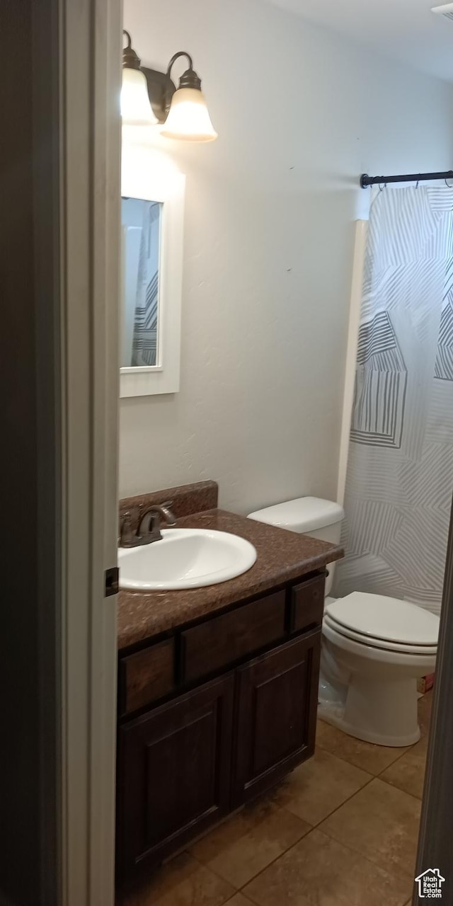 42 E 780 S, Ephraim, UT 84627 - bathroom with tile patterned floors, vanity, toilet, and a shower with shower curtain