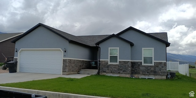42 E 780 S, Ephraim, UT 84627 - view of front of home featuring stone siding, driveway, stucco siding, and an attached garage