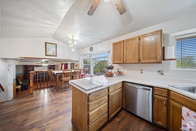 kitchen with stainless steel dishwasher, ceiling fan, a peninsula, brown cabinetry, and vaulted ceiling