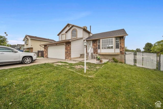 view of front of home featuring driveway and stone siding