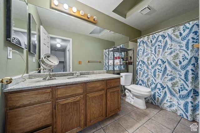 full bathroom featuring tile patterned floors, toilet, and vanity