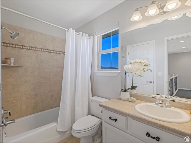 full bathroom featuring toilet, shower / tub combo with curtain, and vanity