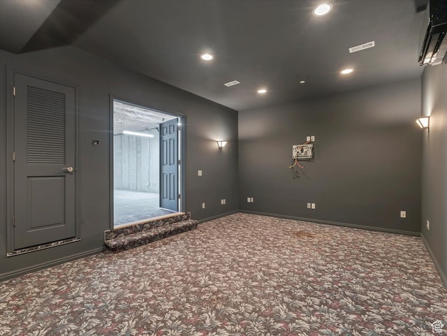 carpeted empty room featuring recessed lighting and baseboards