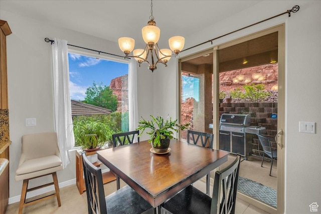 1668 W Lakota Dr, St George, UT 84770 - dining room featuring a chandelier and baseboards