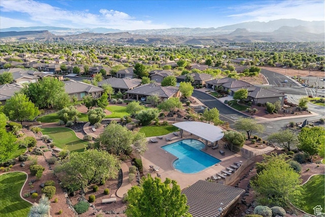 1668 W Lakota Dr, St George, UT 84770 - view of property location with mountains, nearby suburban area, and a pool area