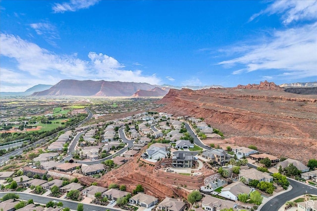 1668 W Lakota Dr, St George, UT 84770 - aerial view of property's location featuring a mountain backdrop and nearby suburban area