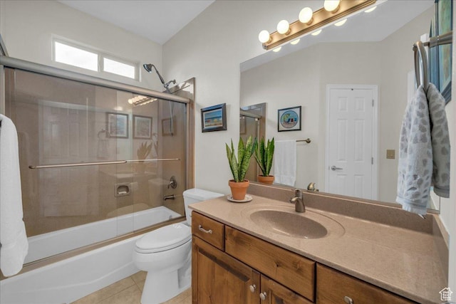 1668 W Lakota Dr, St George, UT 84770 - bathroom featuring tile patterned floors, toilet, vanity, and enclosed tub / shower combo