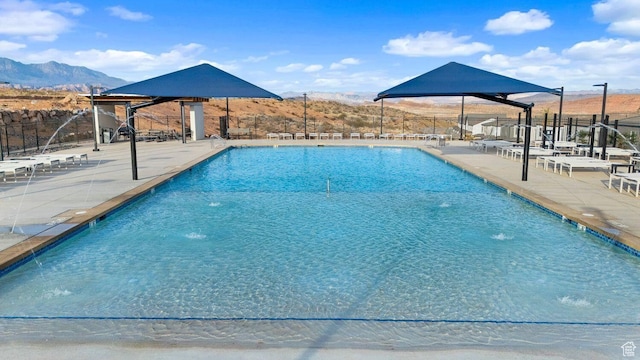 1674 S Ripple Rock Dr Unit 3178, Washington, UT 84780 - community pool with fence, a patio area, and a mountain view